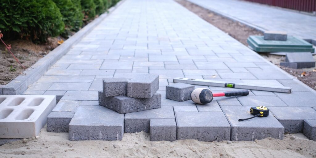 A brick pathway that is currently getting built.